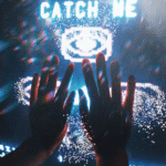 Hands reaching towards a digital screen displaying 'catch me', creating an interactive and futuristic feel.